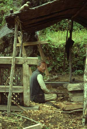 Local carpenter making traditional window 